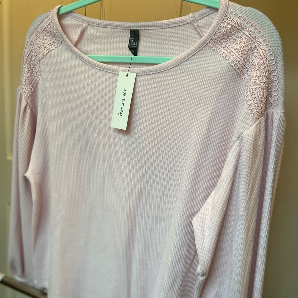 Francesca’s pink sweater